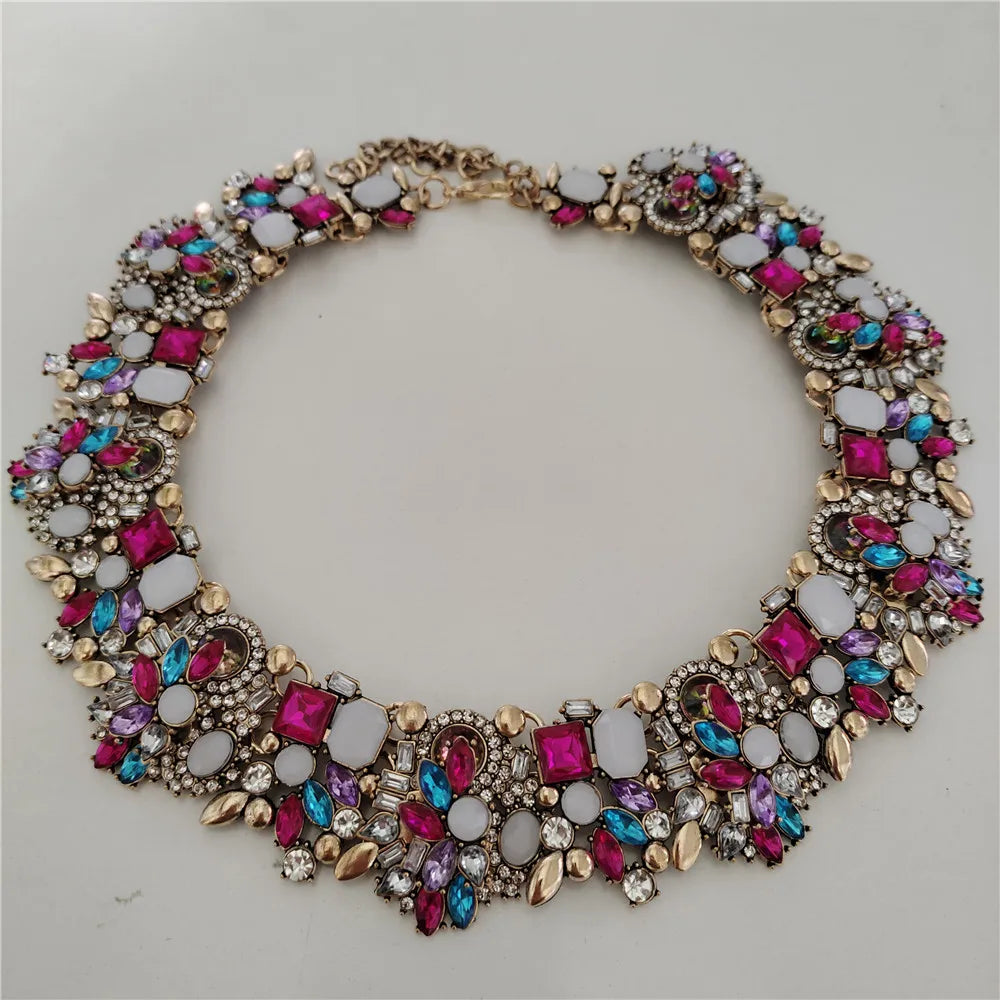 Colorful jeweled necklace on a light gray background