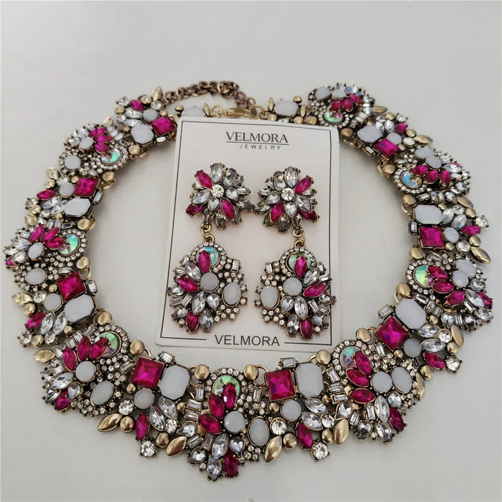 Jewelry set with necklace and earrings on a card labeled 'Fashion Jewelry' against a light gray background.