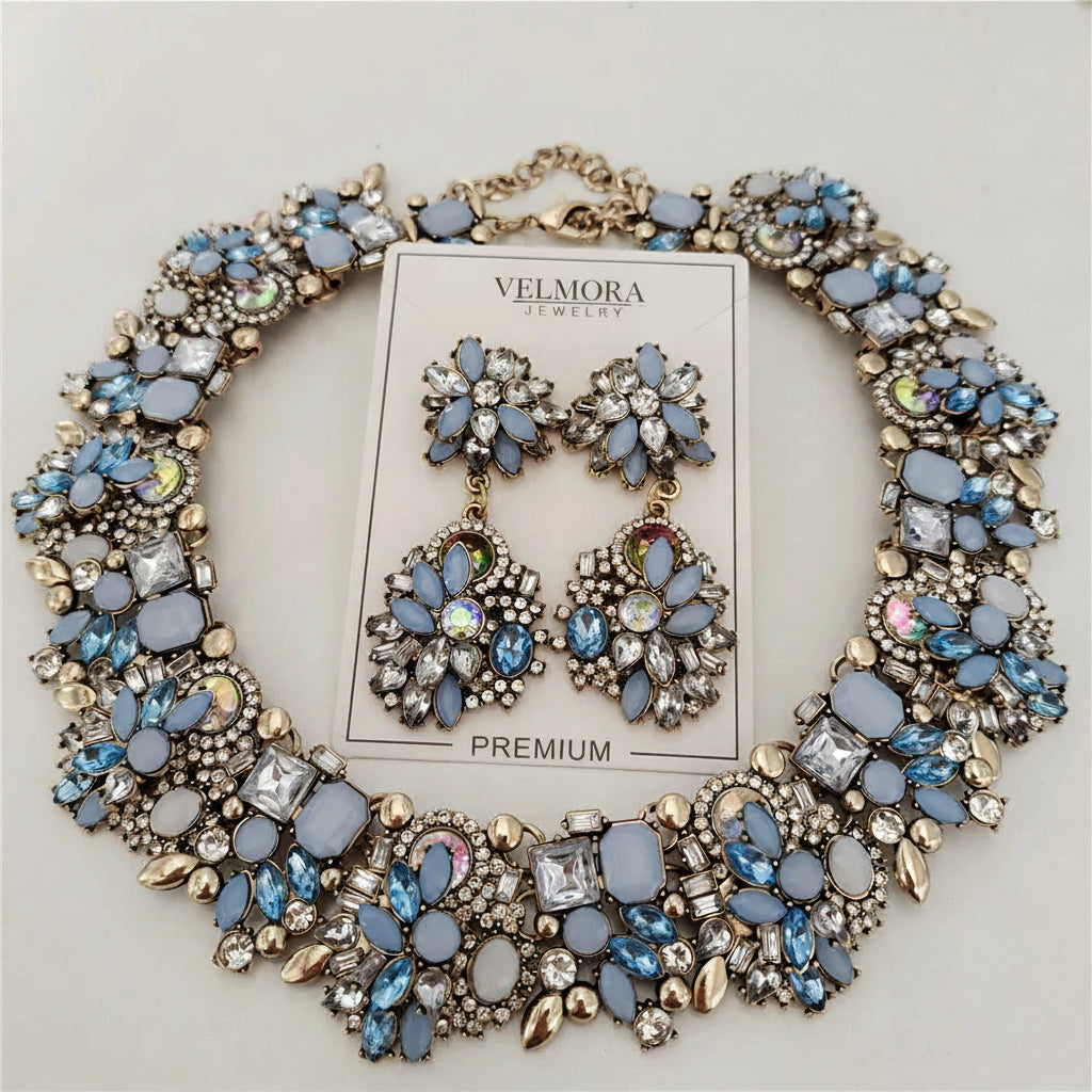 Jewelry set with necklace and earrings on a light gray background