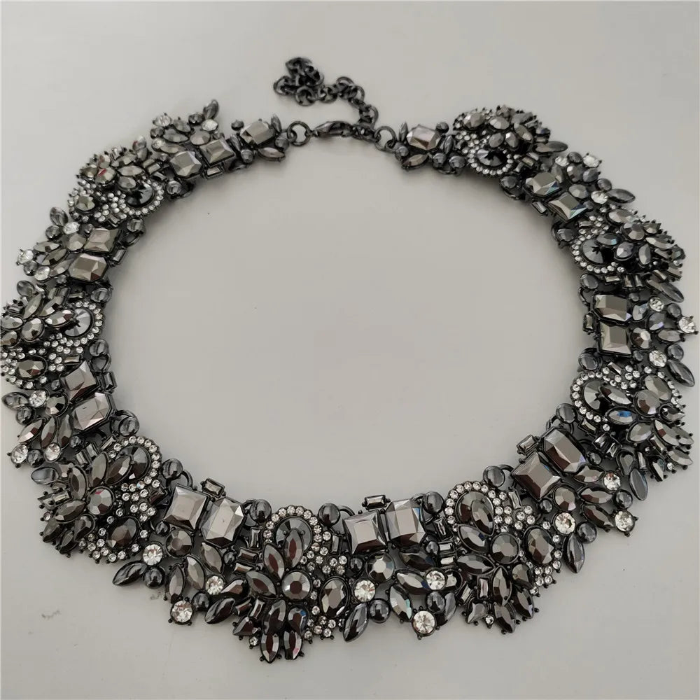 Decorative necklace with intricate design on a light gray background
