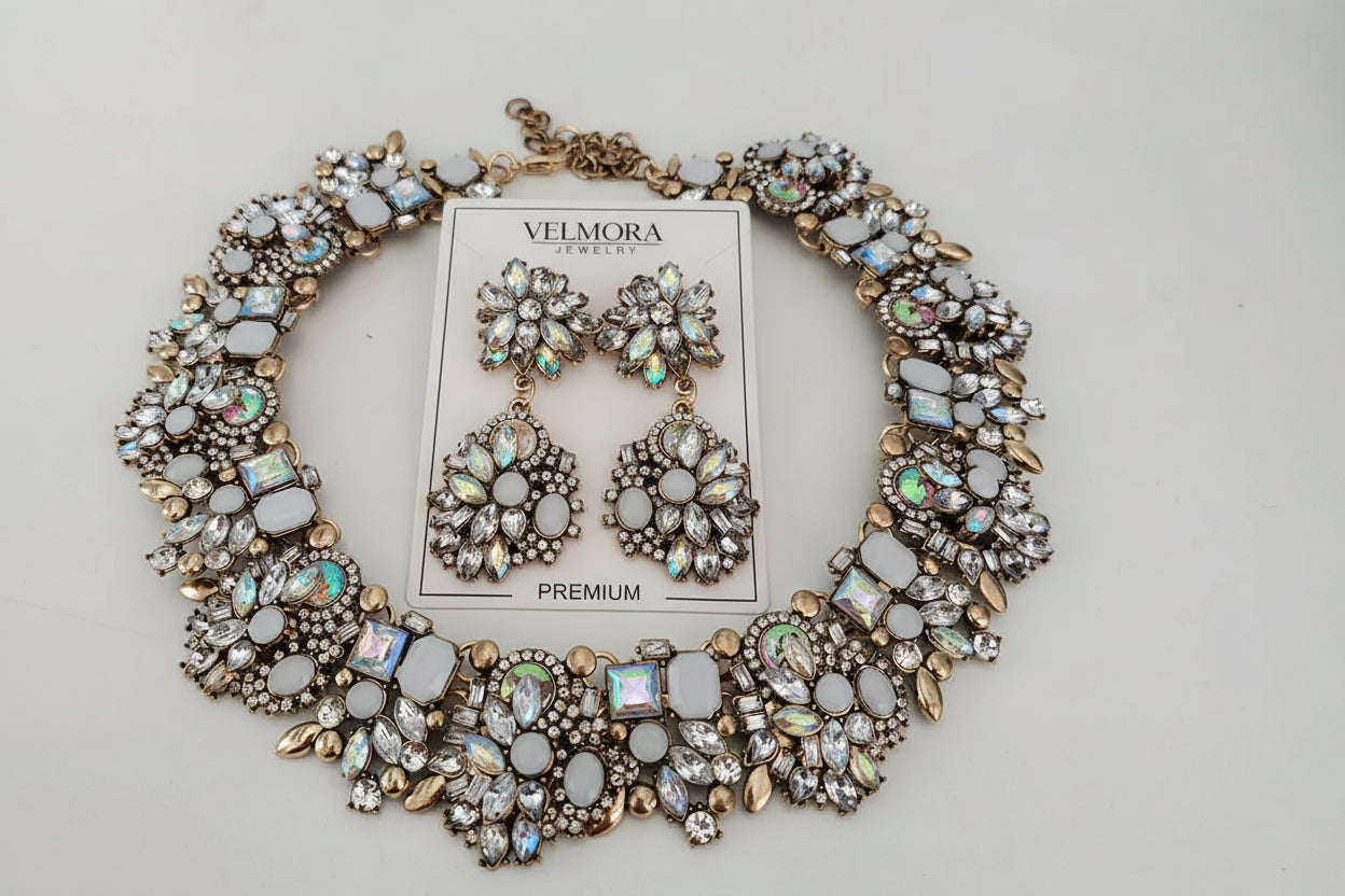 Jewelry set with necklace and earrings on a light gray background