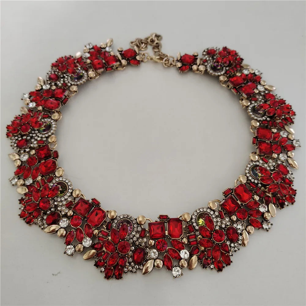 Red gemstone necklace on a gray background