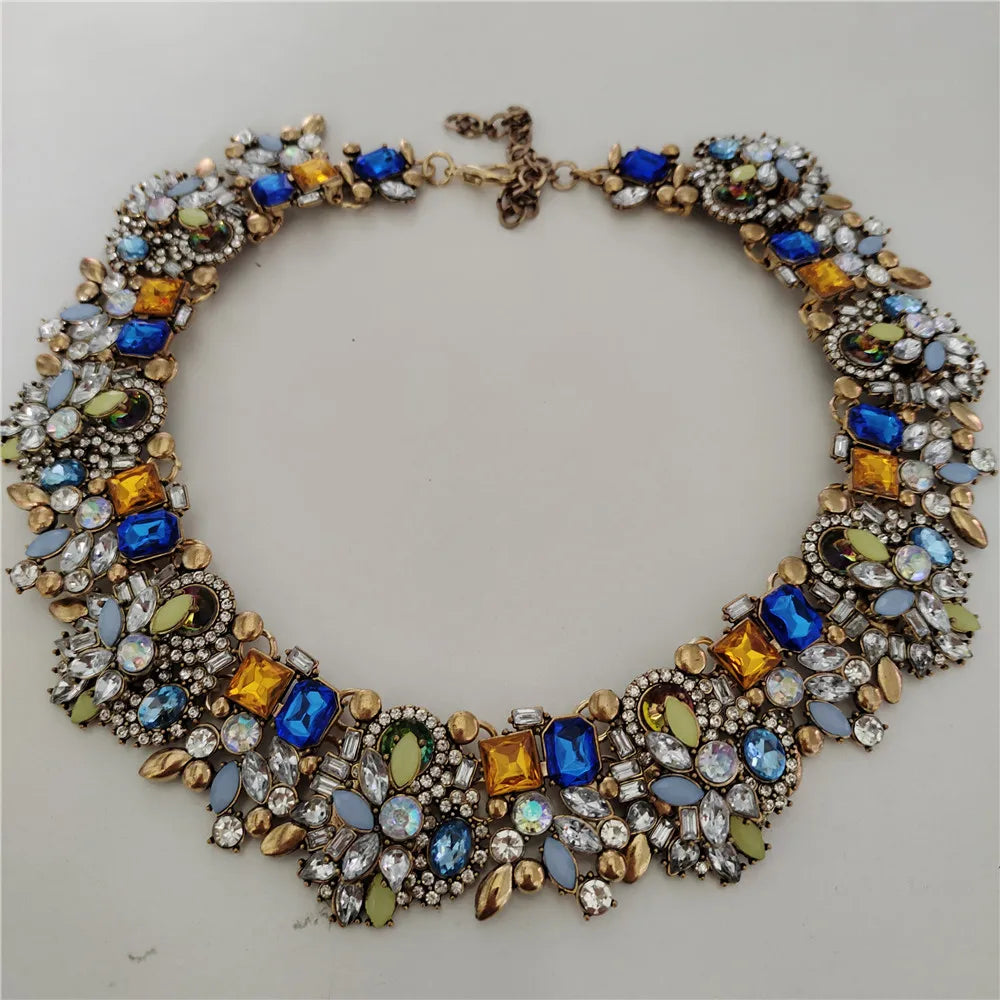 Elegant necklace with colorful gemstones on a light gray background