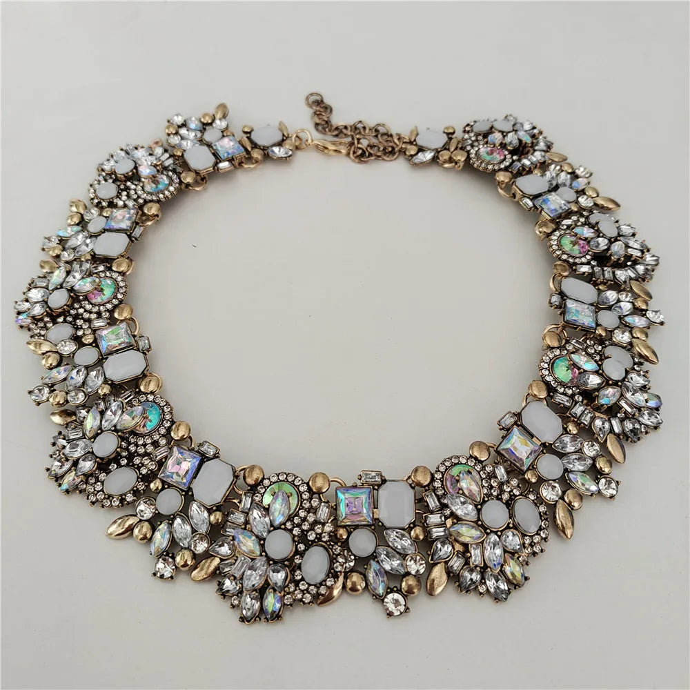 Elegant necklace with gemstones on a light gray background