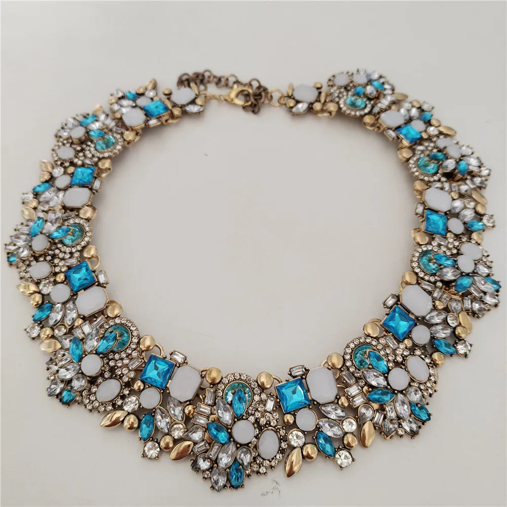 Elegant necklace with blue and white stones on a light gray background